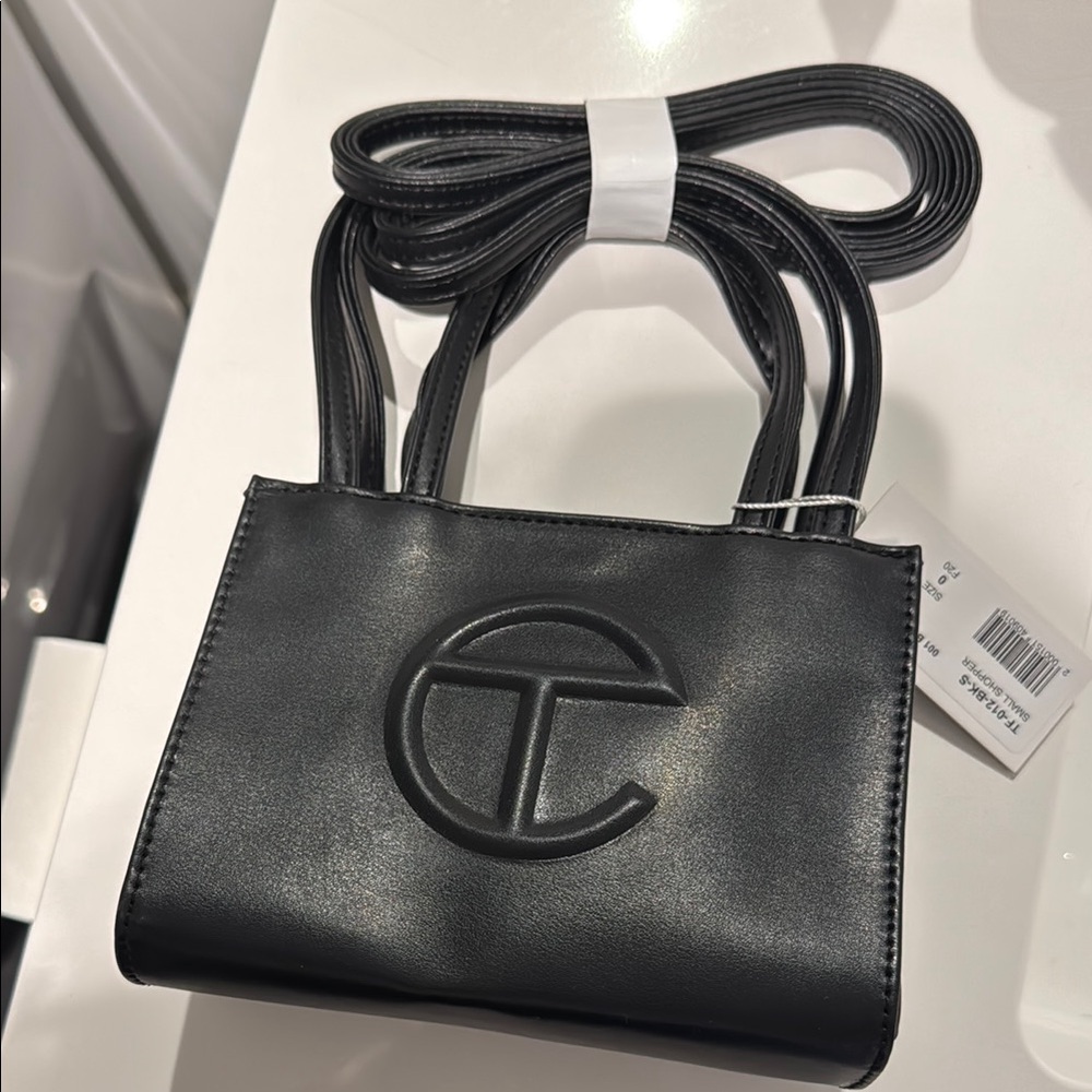 Telfar Black Mini Bag with Embossed Logo and Adjustable Strap